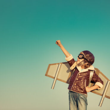 Kid,Pilot,With,Toy,Jetpack,Against,Autumn,Sky,Background.,Happy